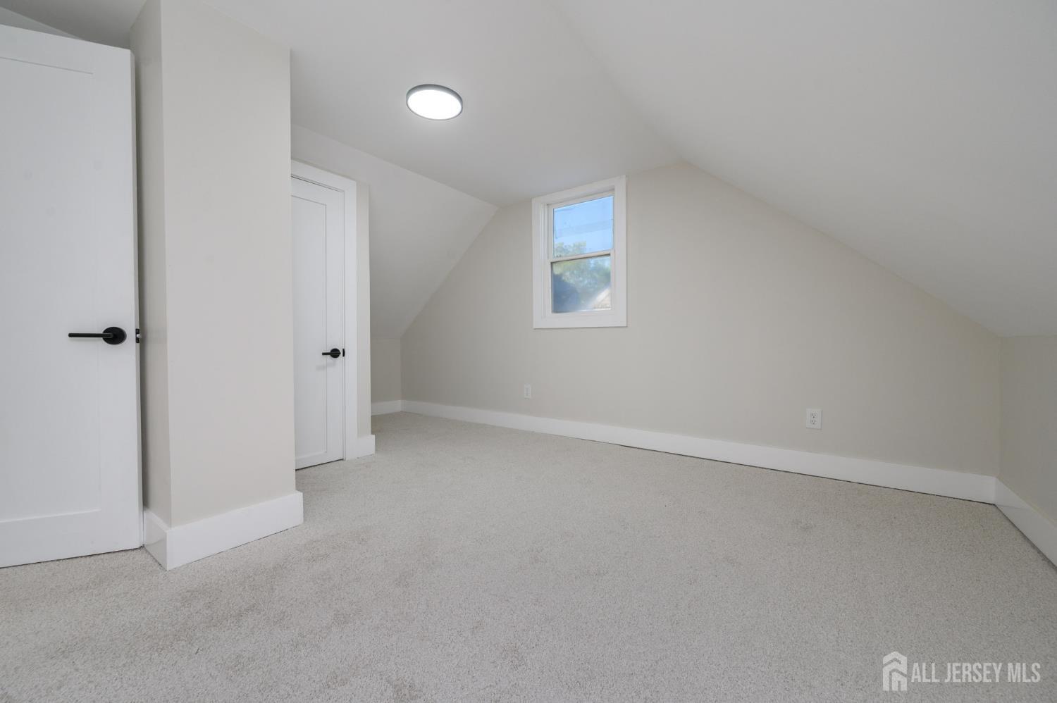 333 1st Street Middlesex, NJ 08846 - Photo 18 of 24 a view of an empty room and a window