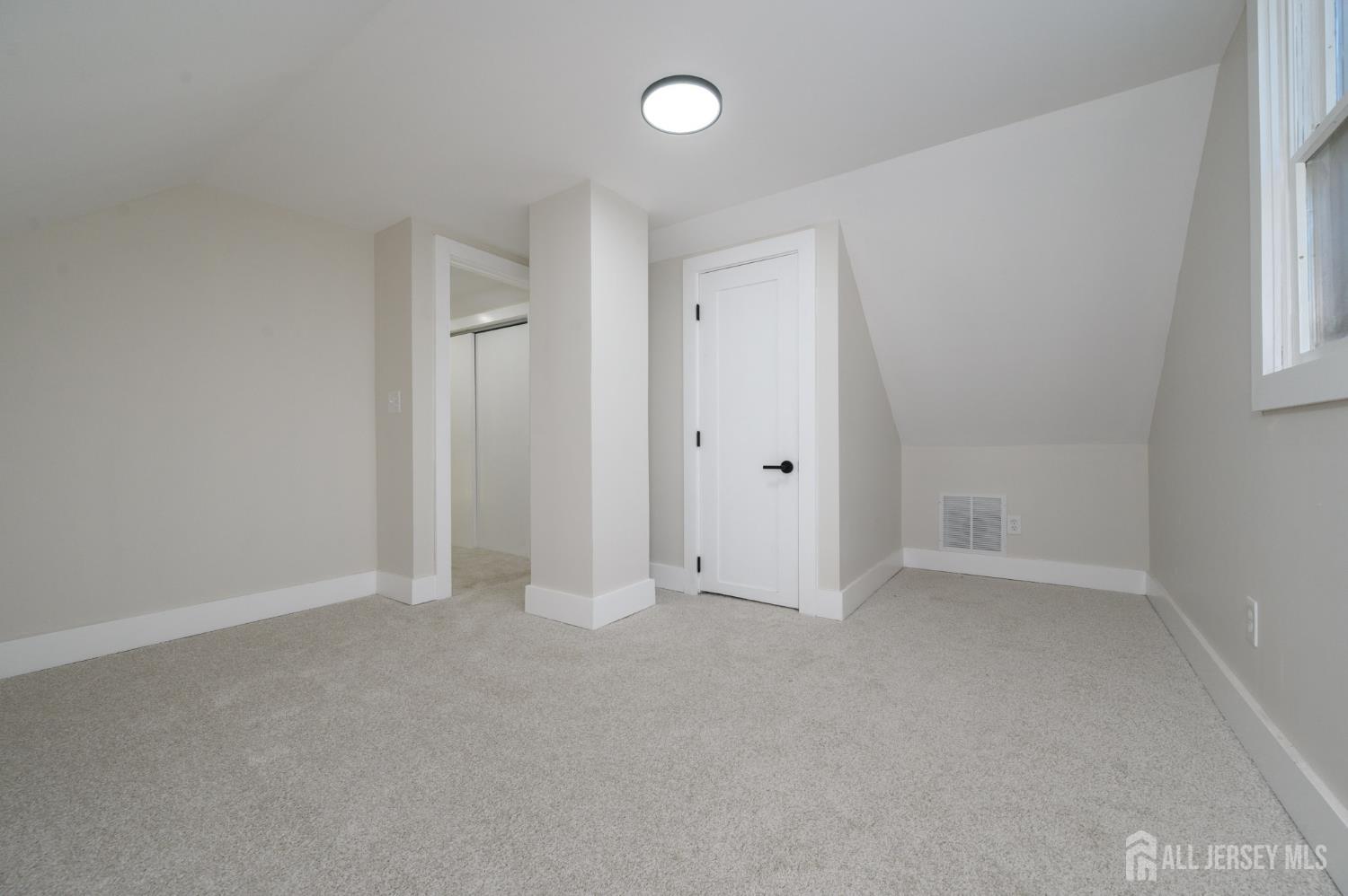 333 1st Street Middlesex, NJ 08846 - Photo 19 of 24 a view of an empty room with a window