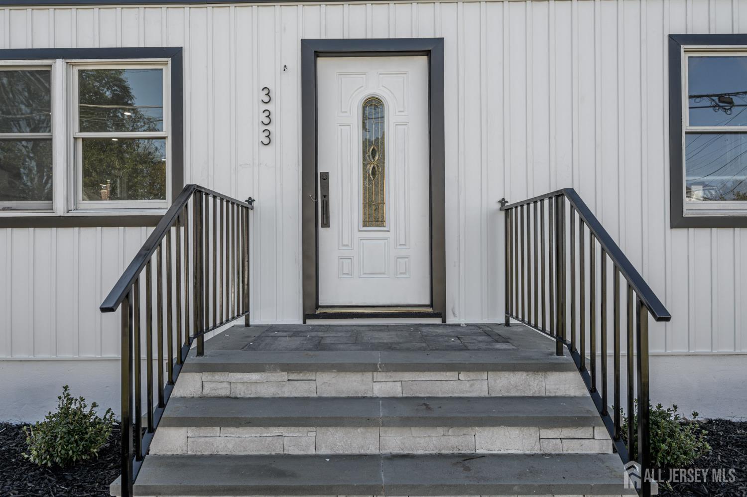 333 1st Street Middlesex, NJ 08846 - Photo 2 of 24 a view of staircase with railing and a window
