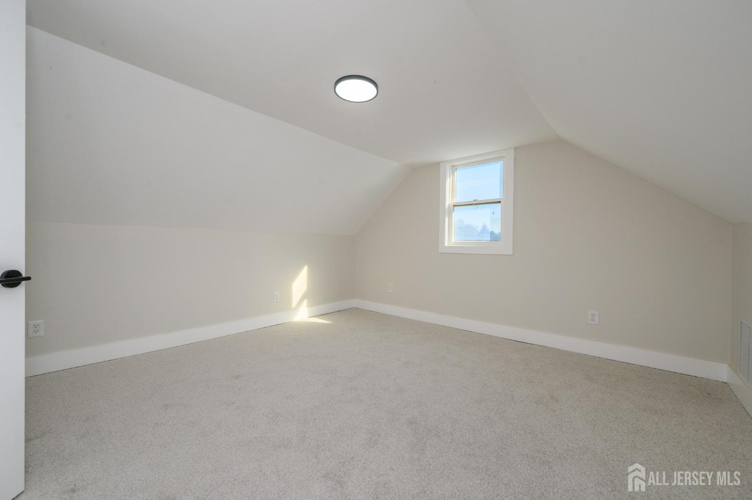 333 1st Street Middlesex, NJ 08846 - Photo 21 of 24 an empty room with a empty space and window