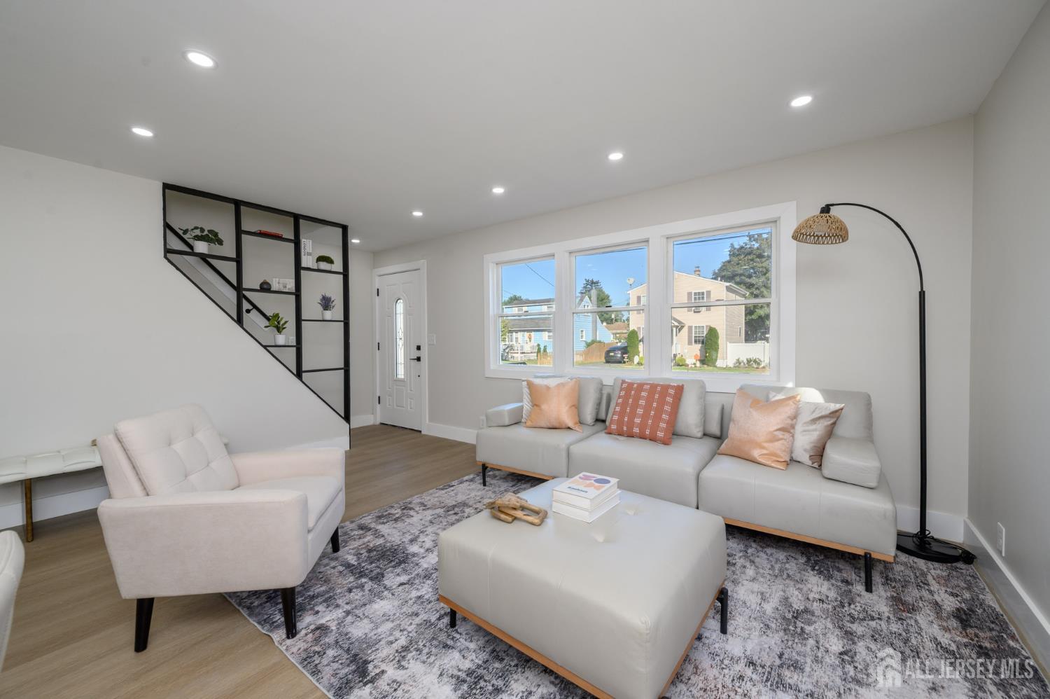 333 1st Street Middlesex, NJ 08846 - Photo 4 of 24 a living room with furniture and a large window