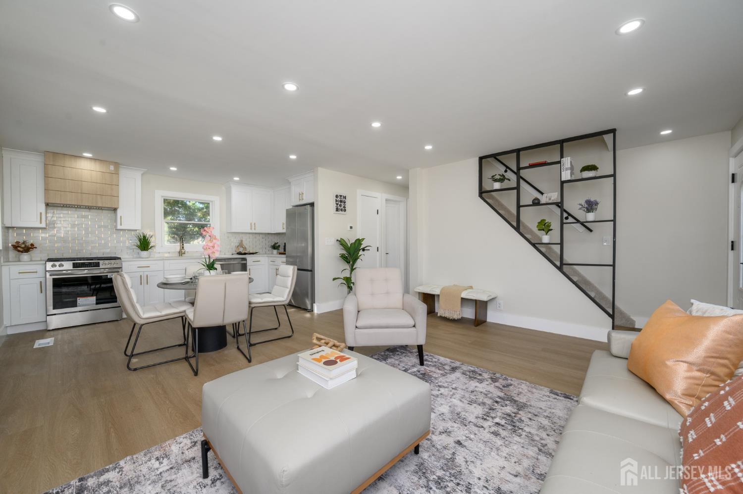 333 1st Street Middlesex, NJ 08846 - Photo 5 of 24 a living room with furniture and wooden floor