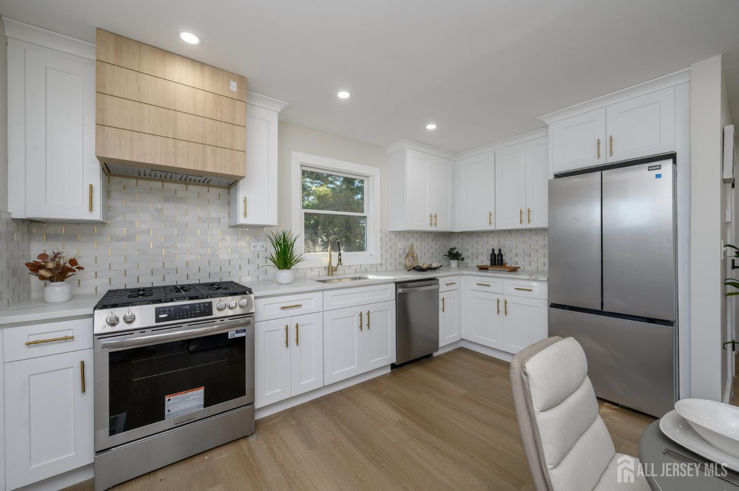 333 1st Street Middlesex, NJ 08846 - Photo 10 of 24 a kitchen with a stove a sink and a refrigerator