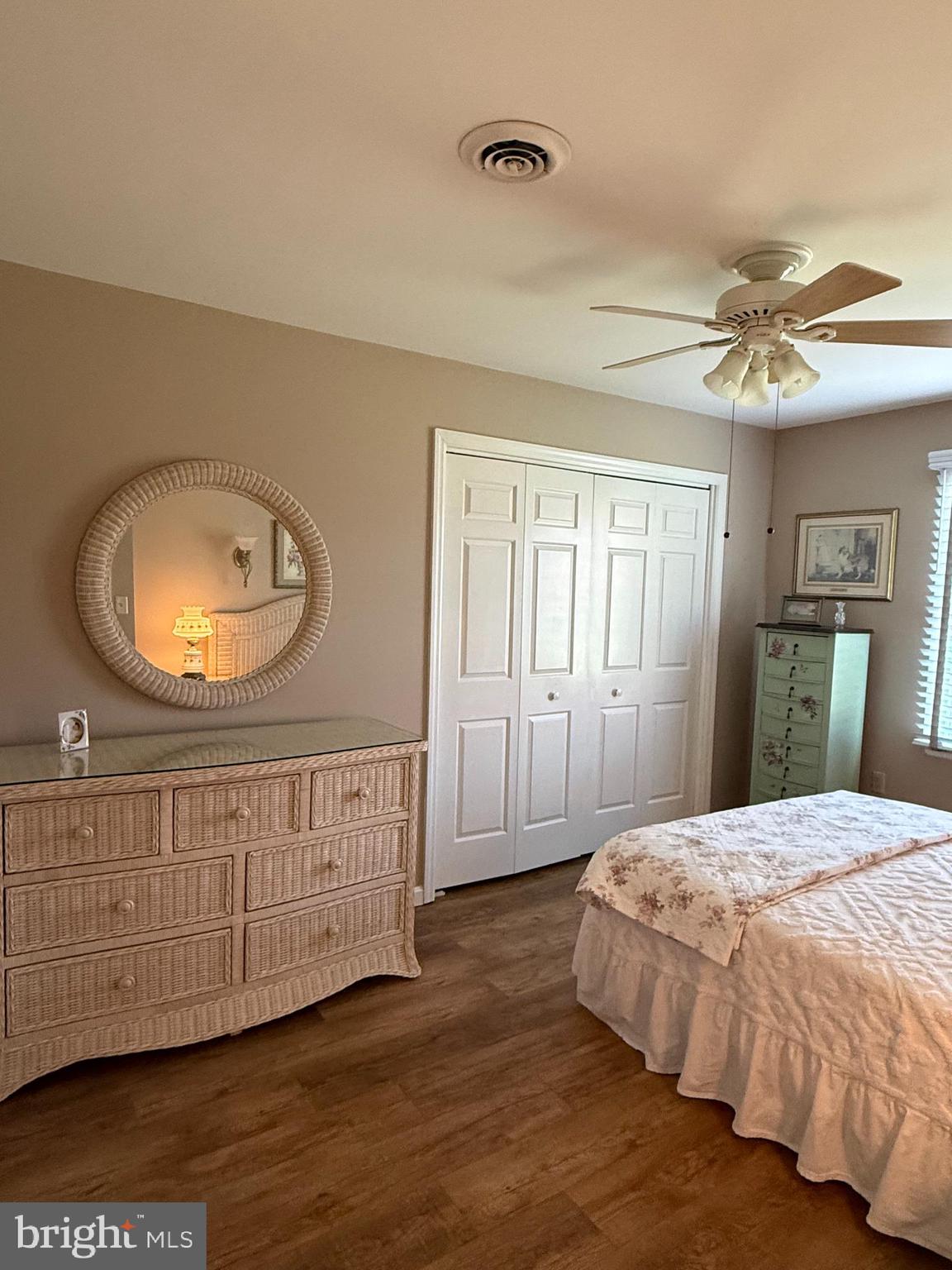 4713 Charles Road Mechanicsburg, PA 17050 - Photo 15 of 19 a bedroom with a bed a mirror and a dresser