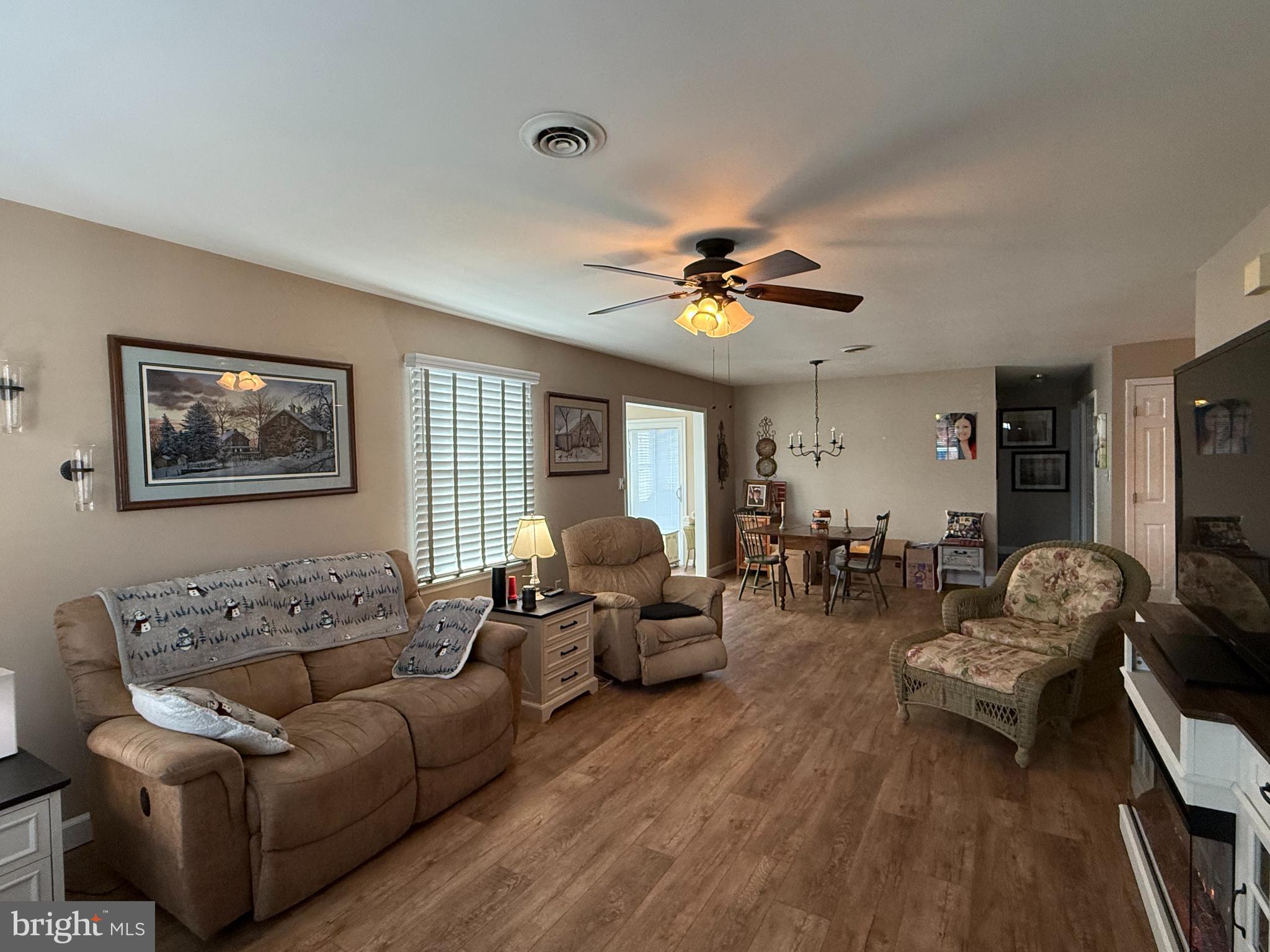4713 Charles Road Mechanicsburg, PA 17050 - Photo 4 of 19 a living room with furniture and wooden floor