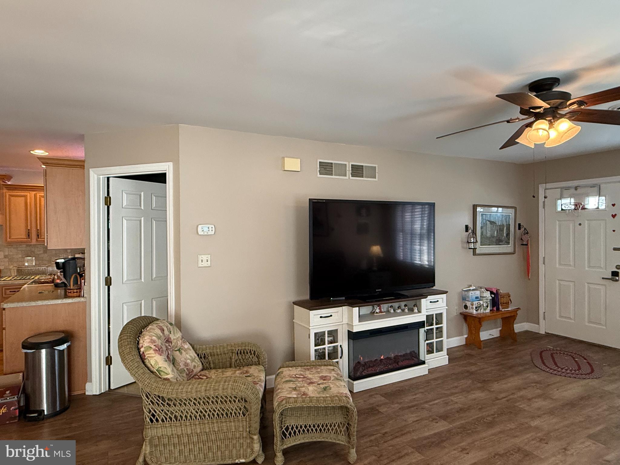 4713 Charles Road Mechanicsburg, PA 17050 - Photo 5 of 19 a living room with furniture and a flat screen tv