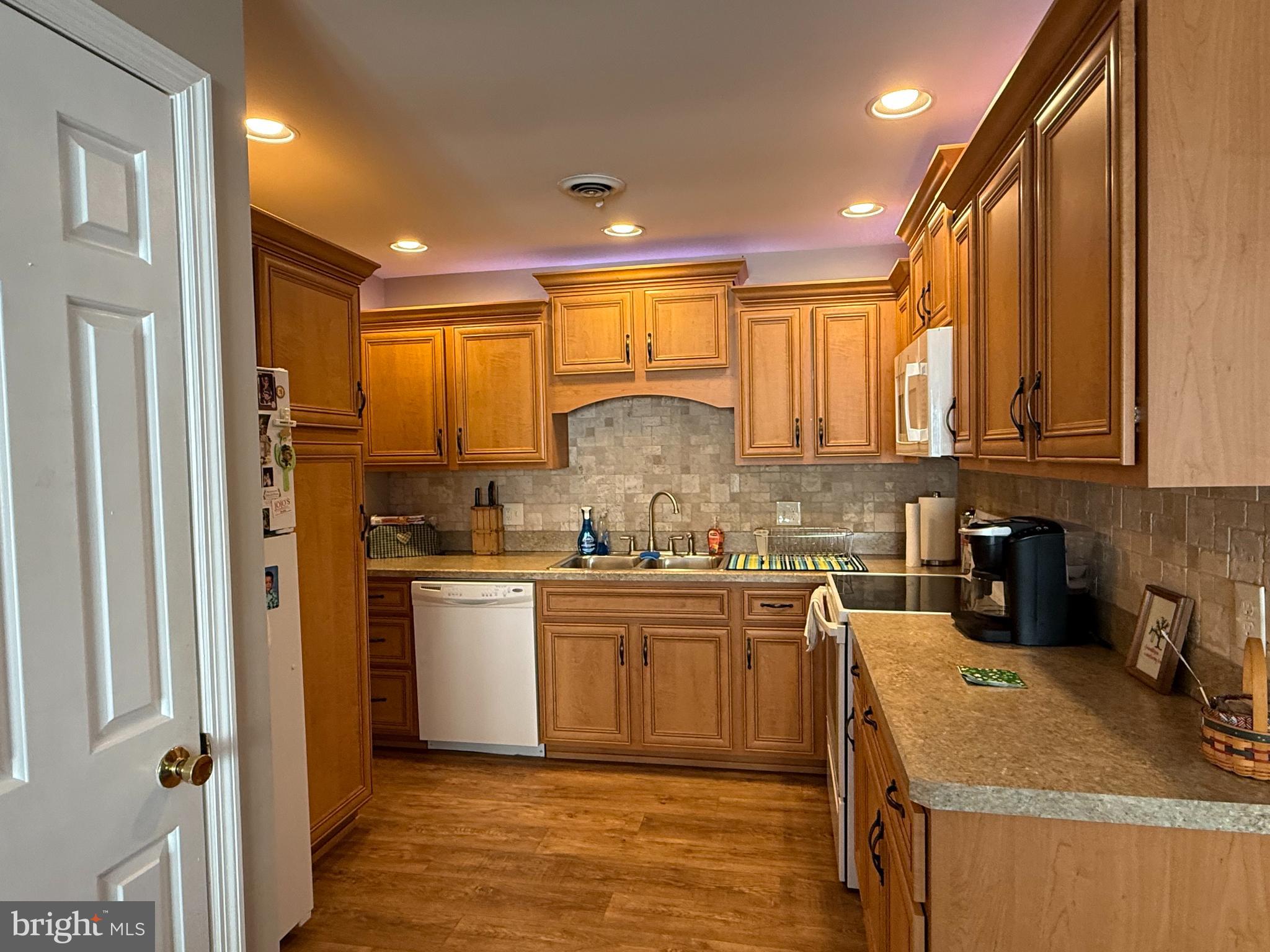 4713 Charles Road Mechanicsburg, PA 17050 - Photo 7 of 19 a kitchen with a sink a stove and cabinets