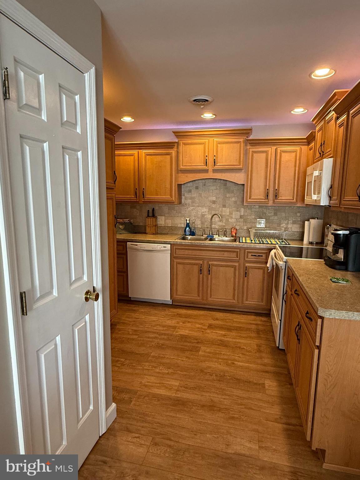 4713 Charles Road Mechanicsburg, PA 17050 - Photo 8 of 19 a large kitchen with stainless steel appliances granite countertop a stove a sink dishwasher and a refrigerator