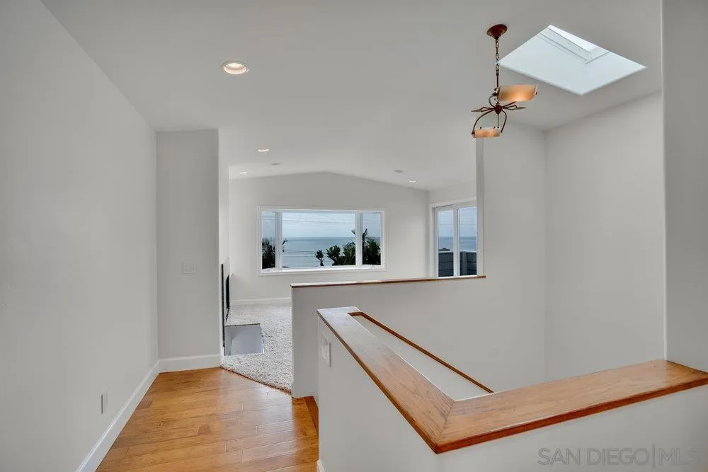 5247 Chelsea Street La Jolla, CA 92037 - Photo 15 of 29 a view of living room with furniture and wooden floor