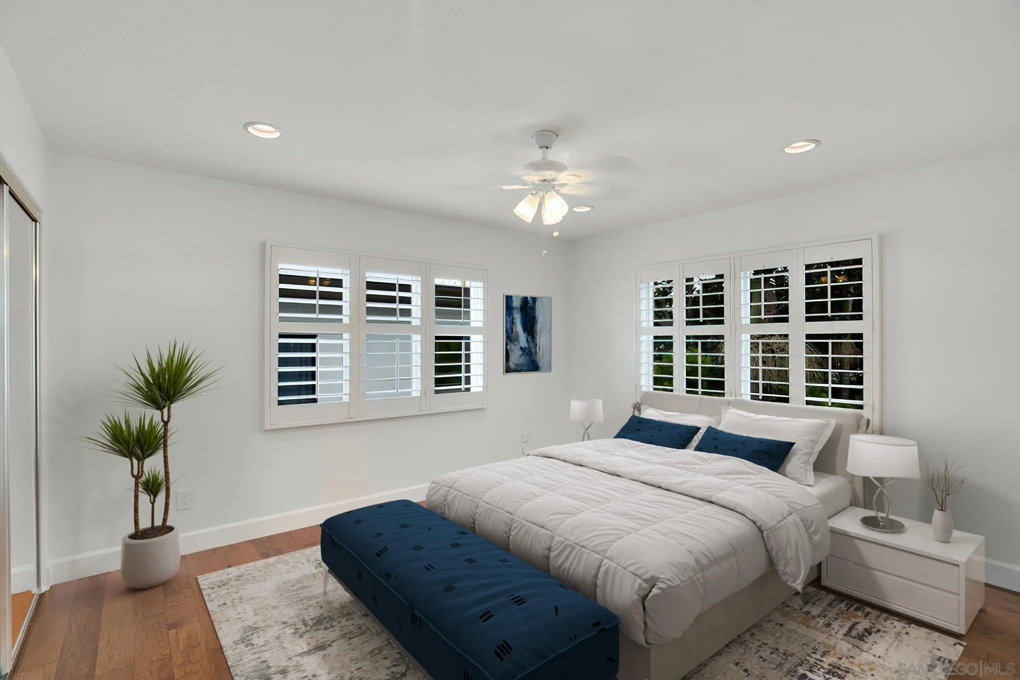 5247 Chelsea Street La Jolla, CA 92037 - Photo 20 of 29 a spacious bedroom with a large bed and a couch
