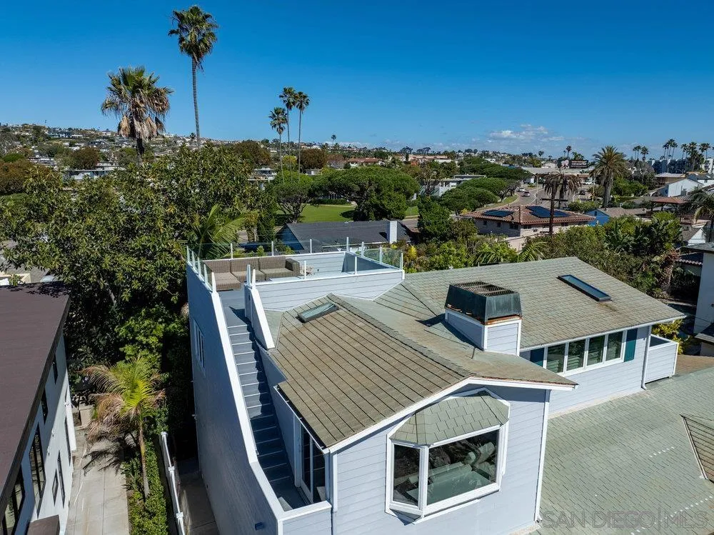 5247 Chelsea Street La Jolla, CA 92037 - Photo 22 of 29 a view of a terrace with a table and chairs