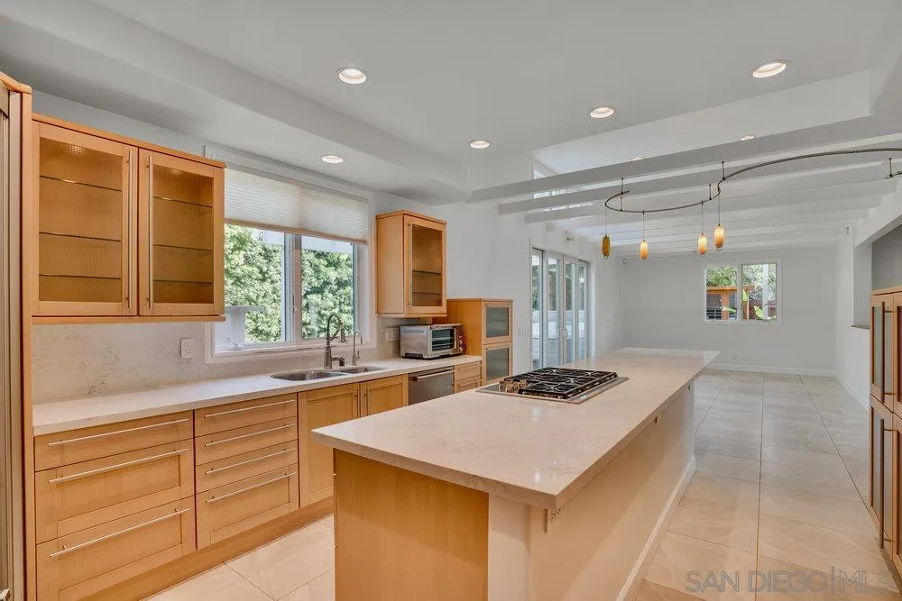 5247 Chelsea Street La Jolla, CA 92037 - Photo 8 of 29 a kitchen with a sink stove and refrigerator