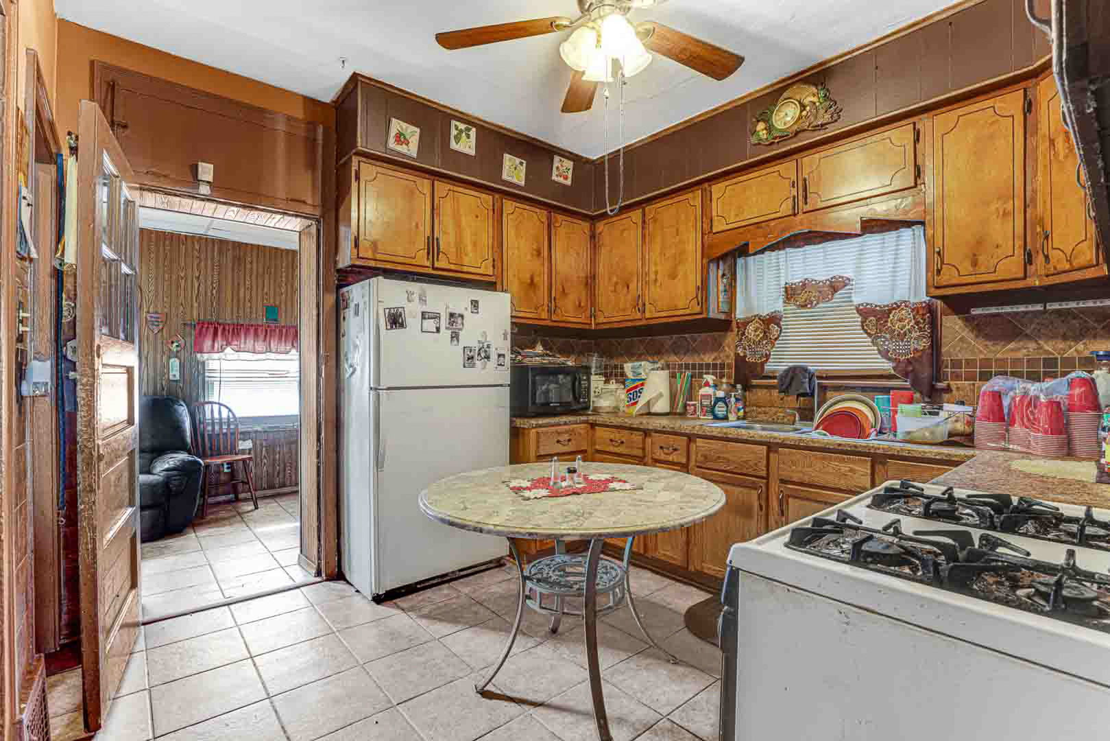 7510 South Carpenter Street Chicago, IL 60620 - Photo 11 of 23 a kitchen with stainless steel appliances granite countertop a sink a stove and a refrigerator
