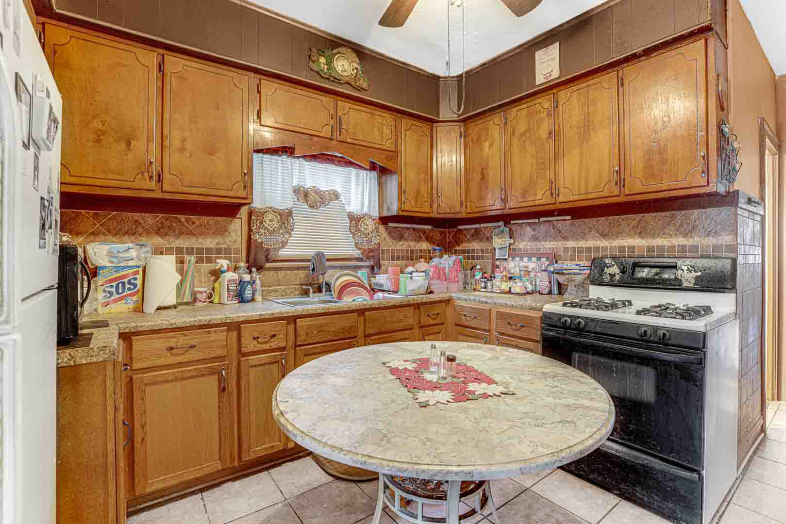 7510 South Carpenter Street Chicago, IL 60620 - Photo 12 of 23 a kitchen with a sink cabinets and appliances