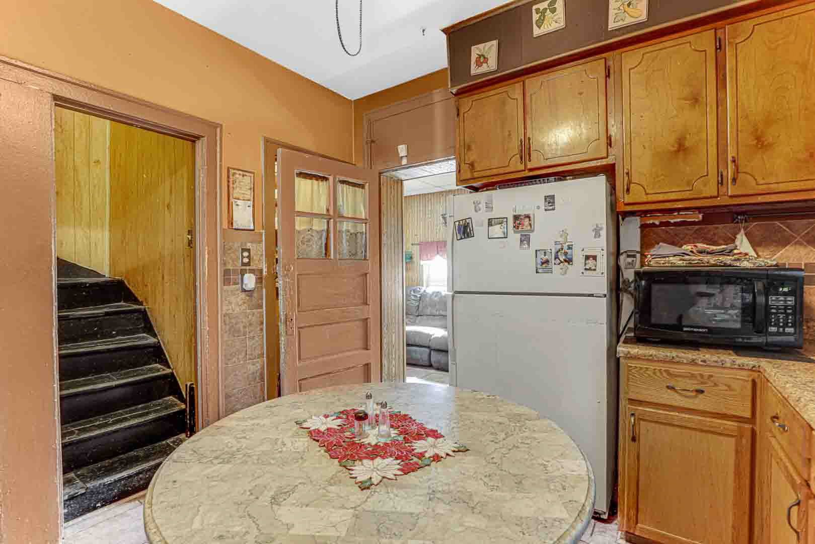 7510 South Carpenter Street Chicago, IL 60620 - Photo 13 of 23 a kitchen with stainless steel appliances a refrigerator and microwave