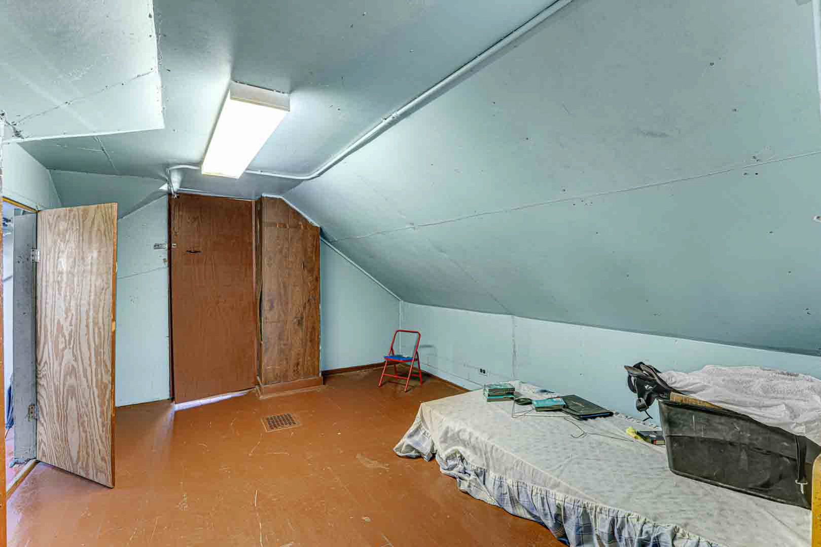7510 South Carpenter Street Chicago, IL 60620 - Photo 17 of 23 a bedroom with a bed and a cabinets