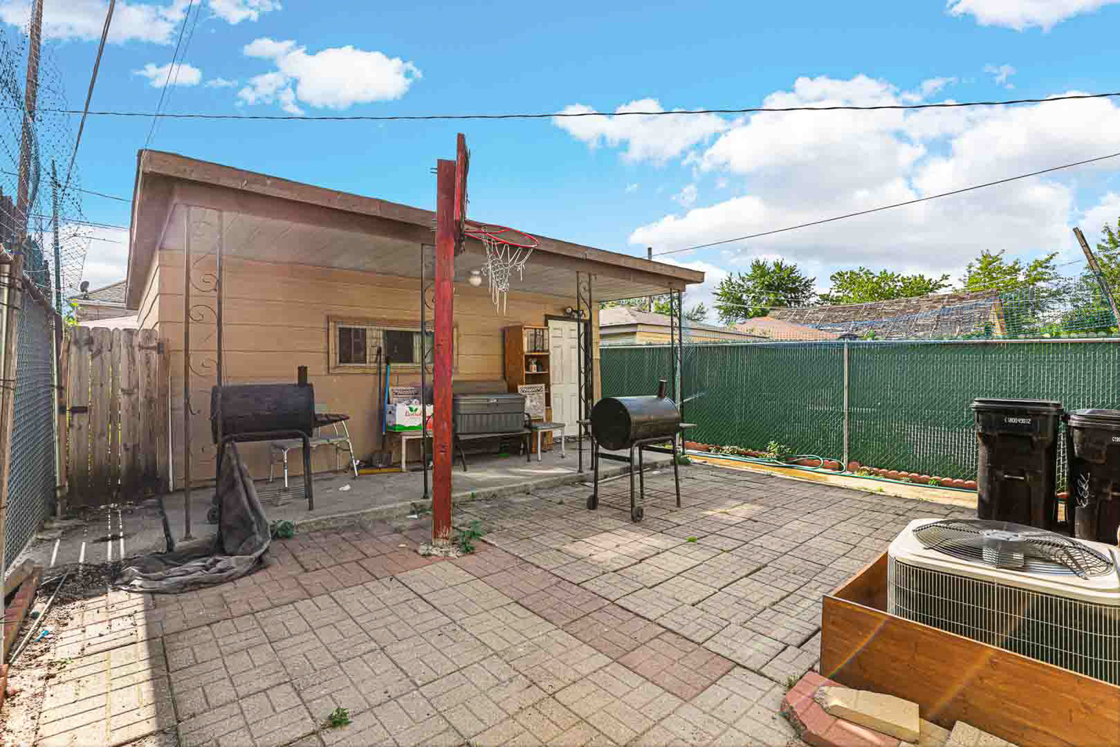 7510 South Carpenter Street Chicago, IL 60620 - Photo 23 of 23 a view of a patio with a dining table and chairs