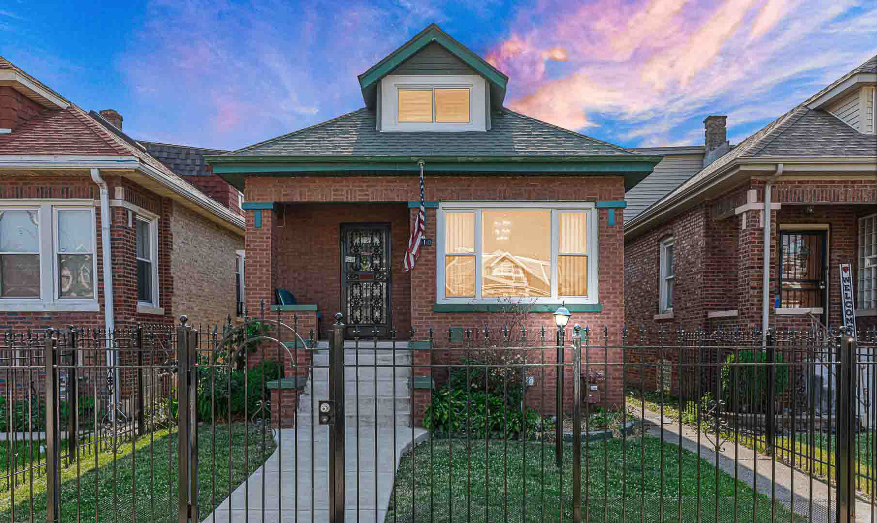 7510 South Carpenter Street Chicago, IL 60620 - Photo 3 of 23 a front view of a house with a porch