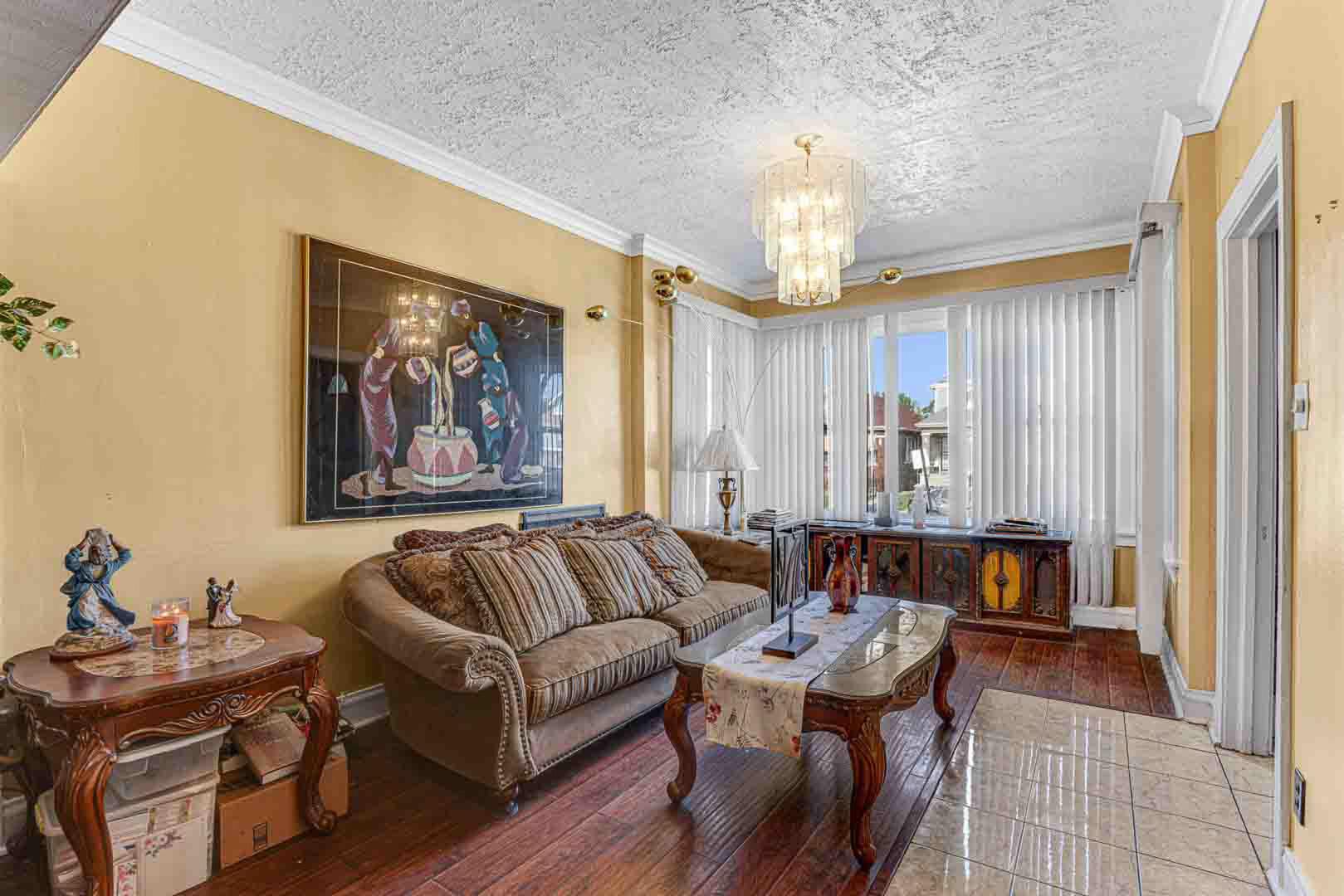 7510 South Carpenter Street Chicago, IL 60620 - Photo 4 of 23 a living room with furniture and a chandelier