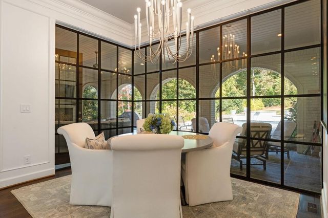 a view of a livingroom with furniture window and wooden floor
