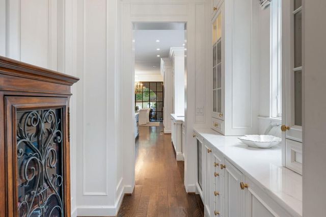 a living room with fireplace furniture and a large window