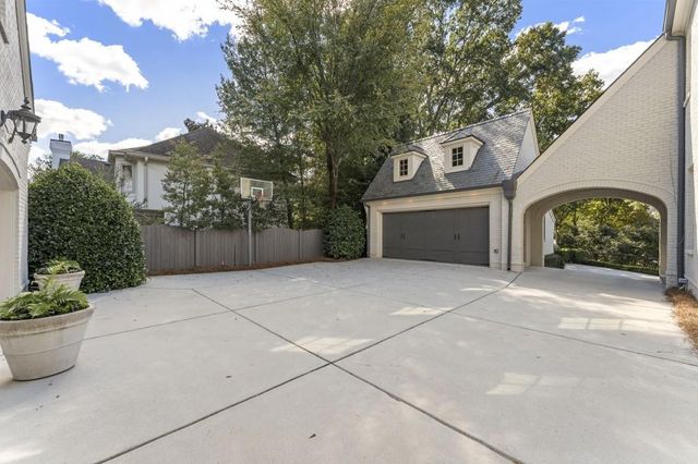 a view of living room with furniture and book shelf