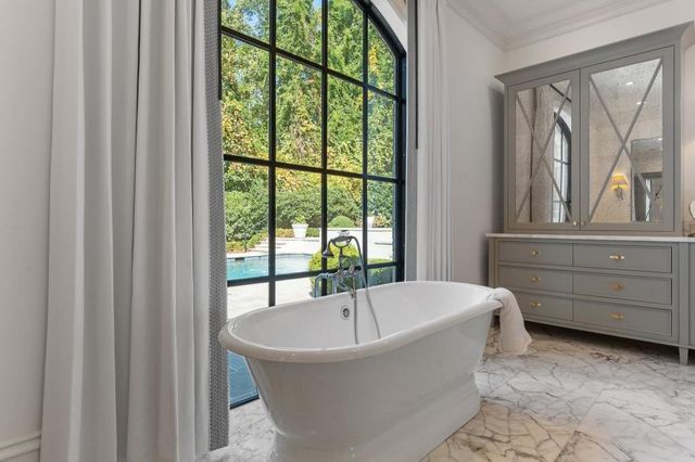 a bathroom with a sink a vanity and a mirror