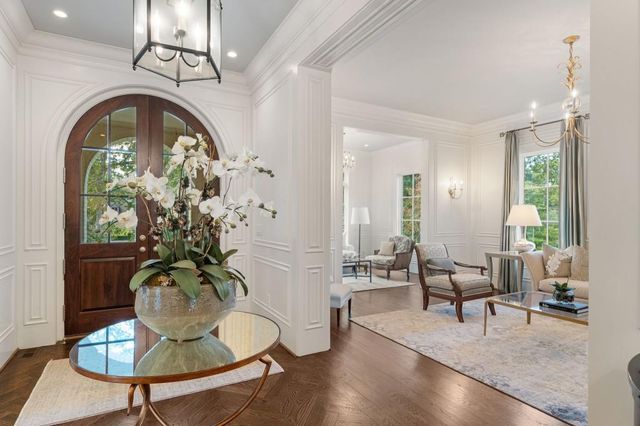 a view of an empty room with window and cabinet