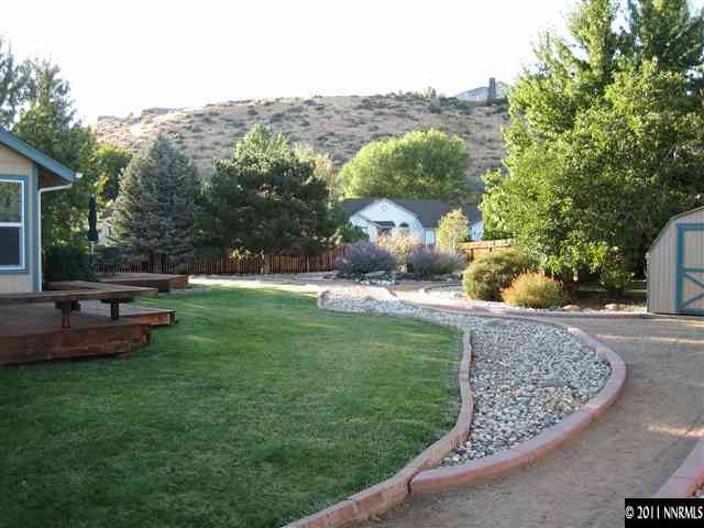 10415 Nighthawk Circle Reno, NV 89523 - Photo 1 of 13 a view of a garden with large trees
