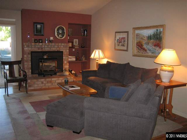 10415 Nighthawk Circle Reno, NV 89523 - Photo 11 of 13 a living room with furniture and a fireplace
