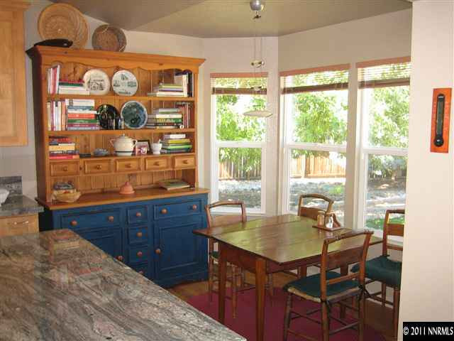 10415 Nighthawk Circle Reno, NV 89523 - Photo 4 of 13 a dining room with wooden floor and a window