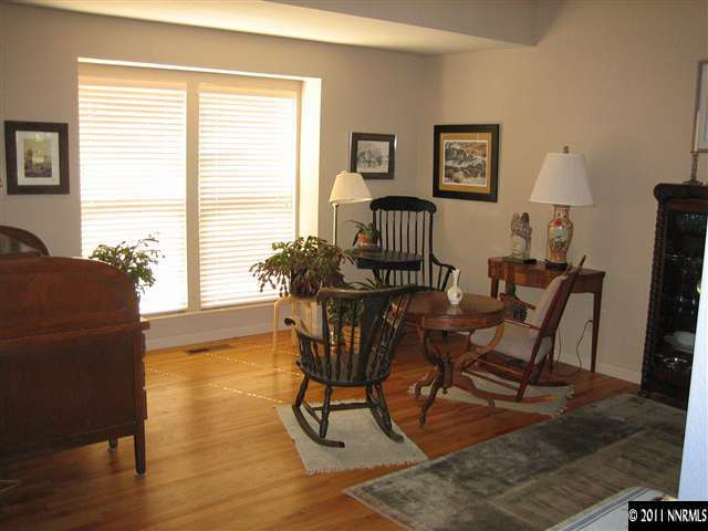 10415 Nighthawk Circle Reno, NV 89523 - Photo 5 of 13 a view of a dining room with furniture and wooden floor