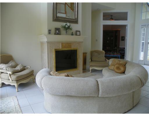4 Castle Hill Way Stuart, FL 34996 - Photo 11 of 16 a living room with furniture and a fireplace