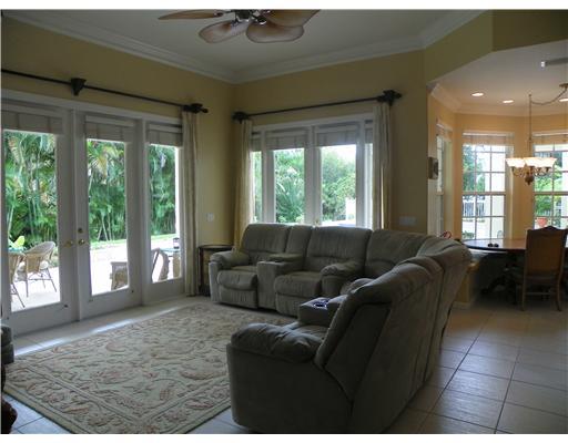 4 Castle Hill Way Stuart, FL 34996 - Photo 2 of 16 a living room with furniture and a window