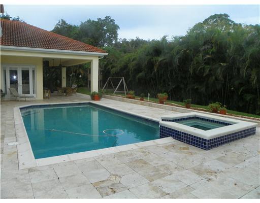 4 Castle Hill Way Stuart, FL 34996 - Photo 4 of 16 a view of a house with pool and a yard