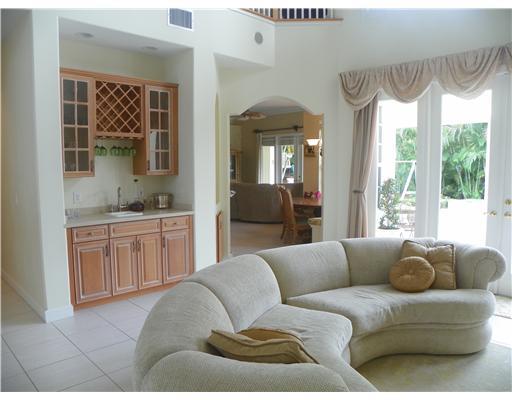 4 Castle Hill Way Stuart, FL 34996 - Photo 5 of 16 a living room with furniture and a large window