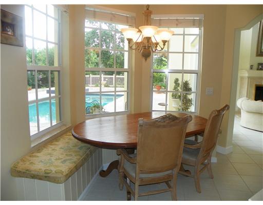 4 Castle Hill Way Stuart, FL 34996 - Photo 6 of 16 a dining room with furniture and window
