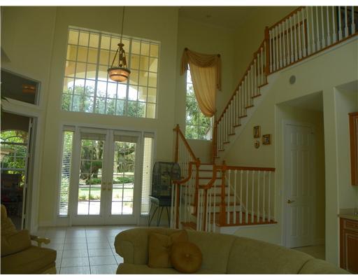 4 Castle Hill Way Stuart, FL 34996 - Photo 8 of 16 a view of entryway and hall with wooden floor