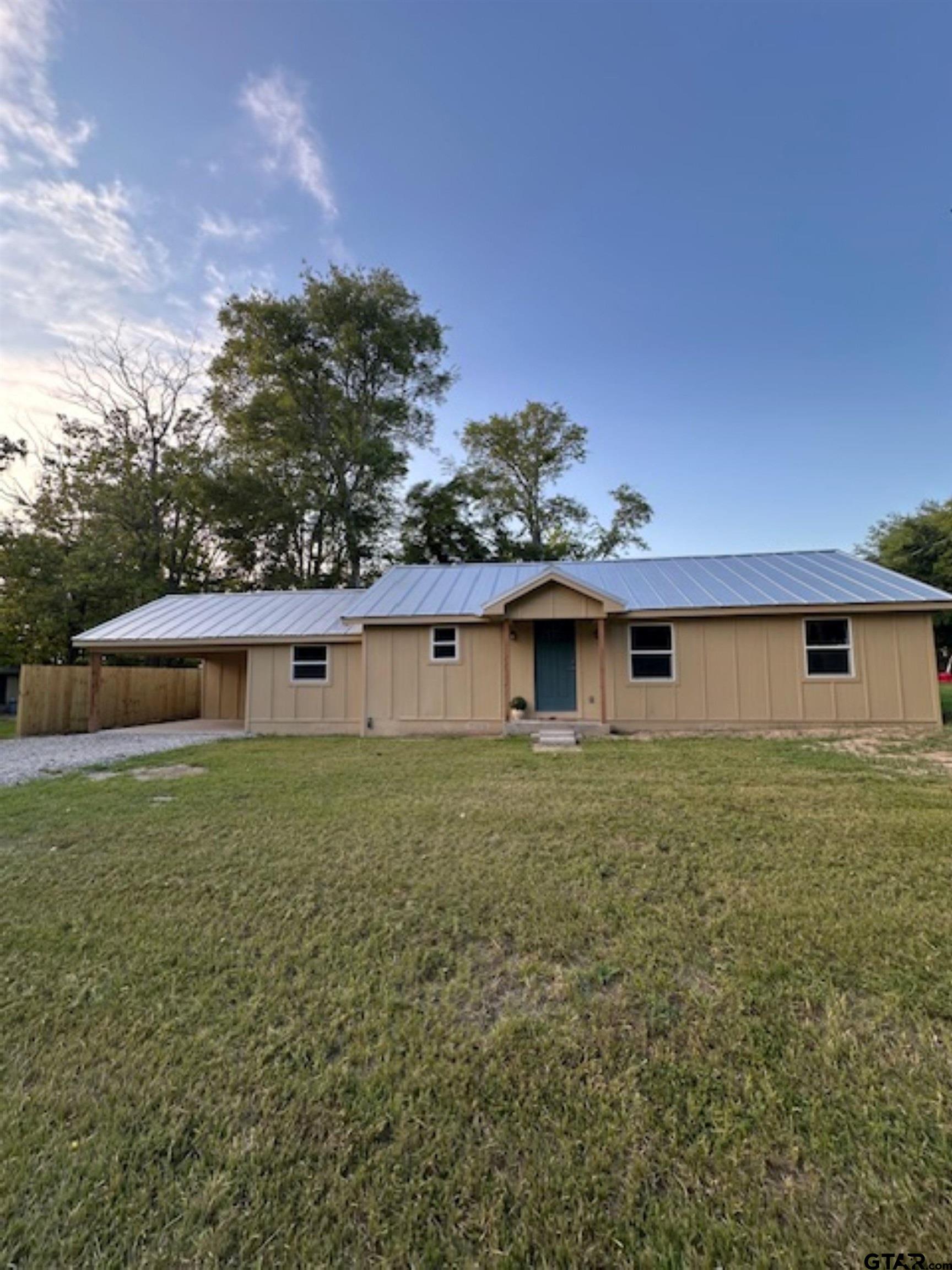 149 East Iowa Street Van, TX 75790 - Photo 1 of 17 a front view of a house with a yard