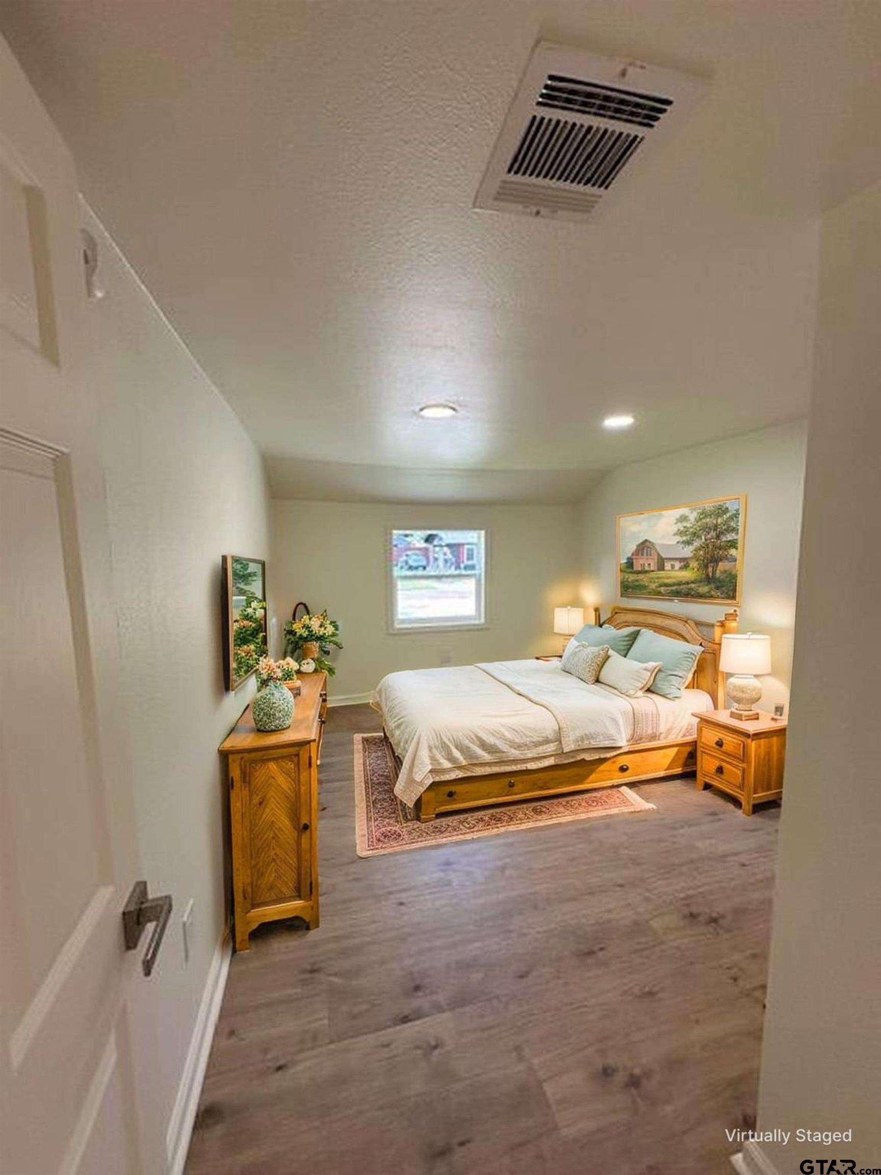 149 East Iowa Street Van, TX 75790 - Photo 2 of 17 a bedroom with a bed and a couch