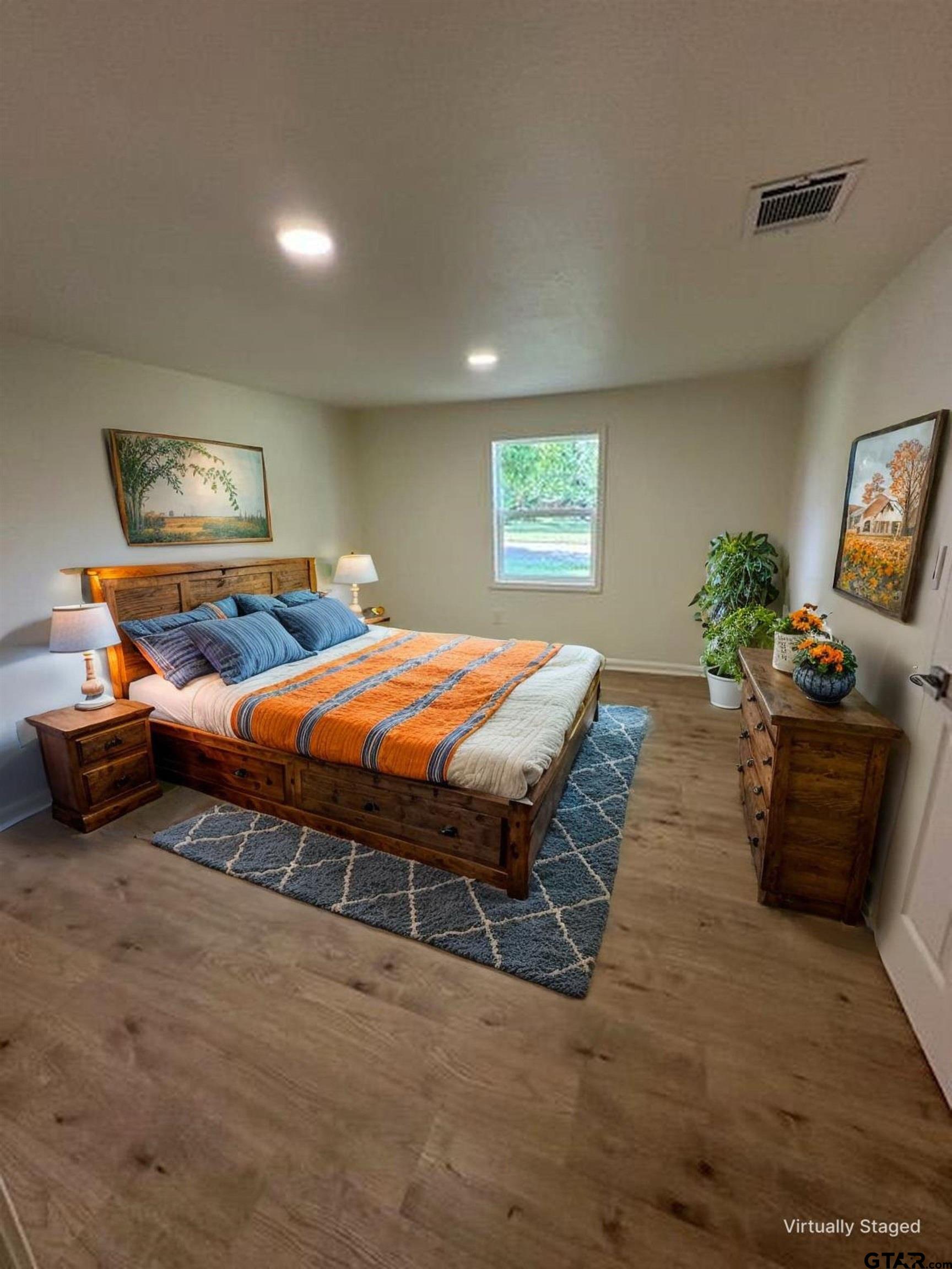 149 East Iowa Street Van, TX 75790 - Photo 8 of 17 a bedroom with a bed and a couch