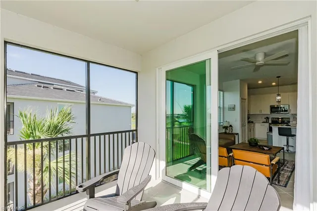 a view of a balcony with chairs