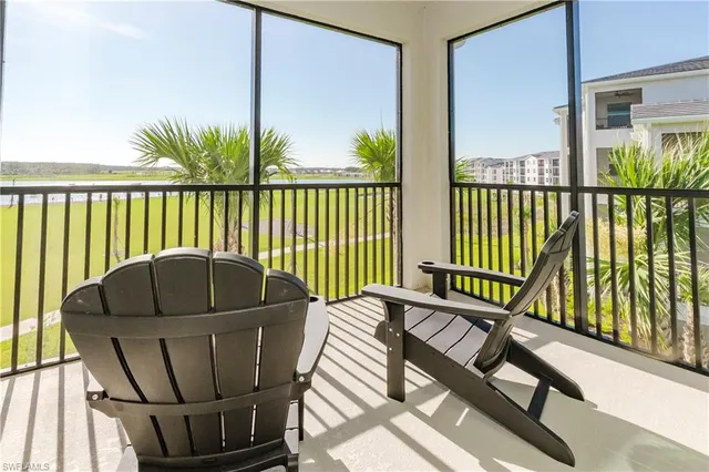 a balcony view with a potted plant