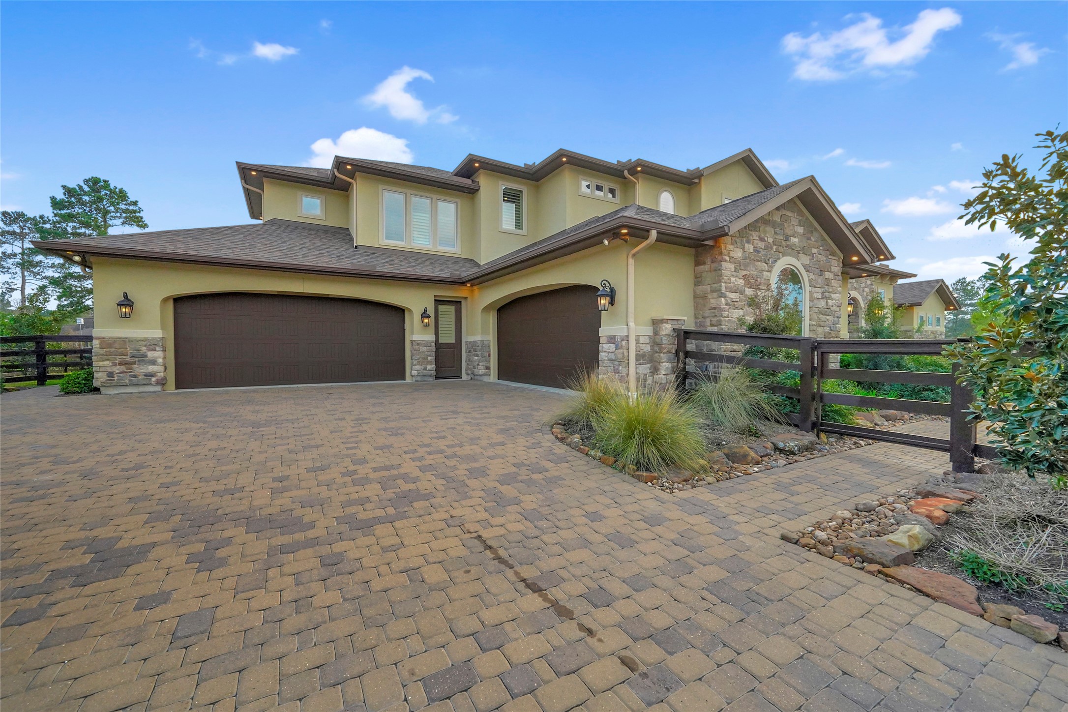 Extra Wide Paver Driveway & Walkways, Gated driveway for extra security and privacy.  Hunter WiFi enabled irrigation system and Lutron Lighting. Home security cameras throughout.