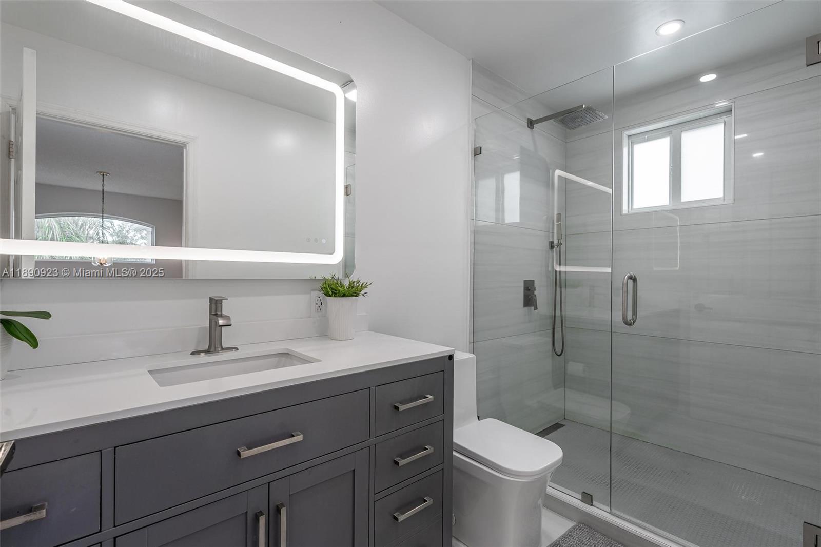 925 Briar Ridge Road Weston, FL 33327 - Photo 11 of 30 a bathroom with a sink toilet and shower