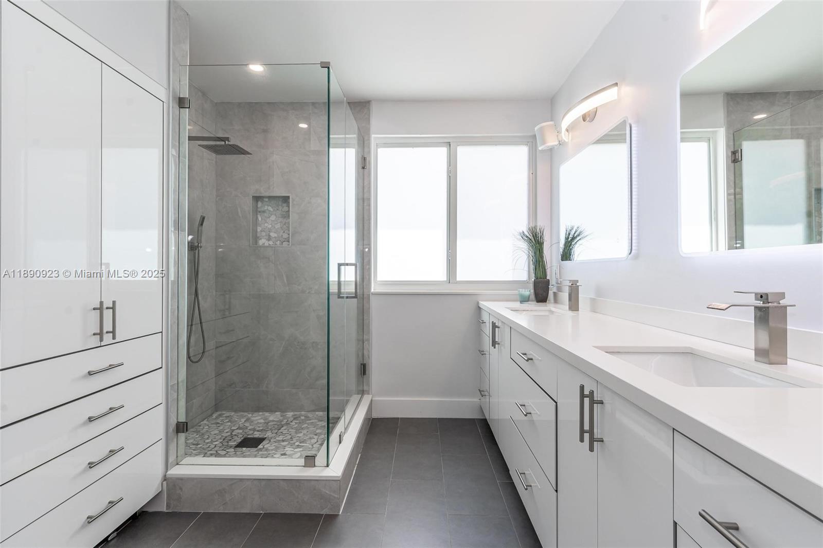 925 Briar Ridge Road Weston, FL 33327 - Photo 12 of 30 a bathroom with a granite countertop sink mirror shower and a bathtub