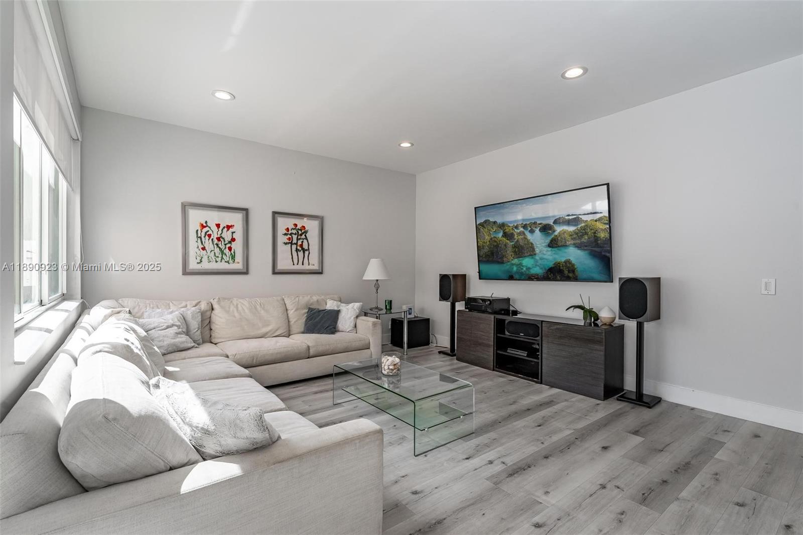 925 Briar Ridge Road Weston, FL 33327 - Photo 16 of 30 a living room with furniture and a flat screen tv