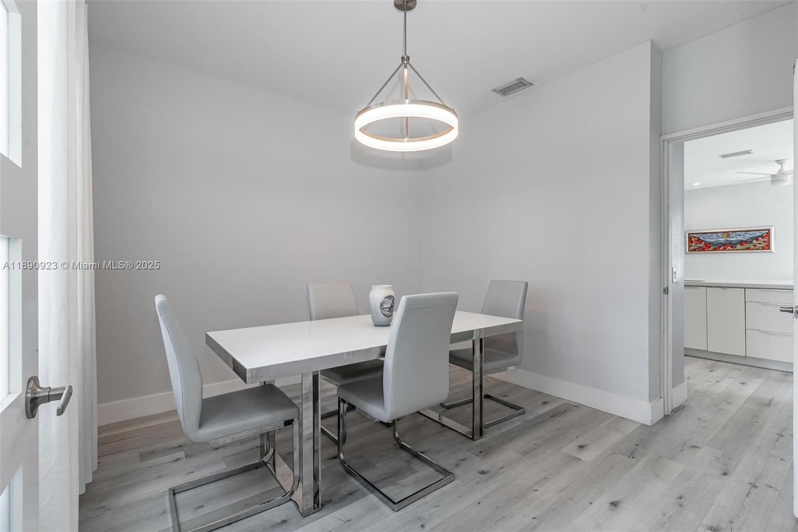 925 Briar Ridge Road Weston, FL 33327 - Photo 22 of 30 a view of a dining room with a table and chairs
