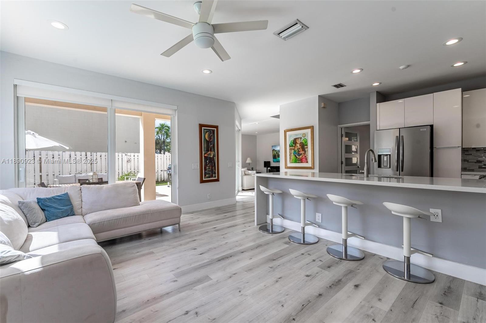 925 Briar Ridge Road Weston, FL 33327 - Photo 24 of 30 a living room with furniture and a wooden floor