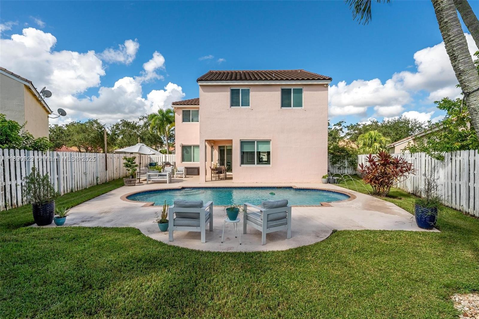 925 Briar Ridge Road Weston, FL 33327 - Photo 30 of 30 a view of a house with backyard